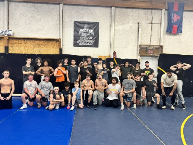 Ascend high school wrestlers in the training facility