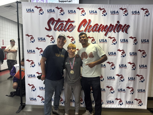 Ascend wrestler celebrating a state championship